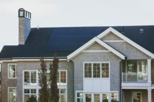Solar panels on a nice two story house