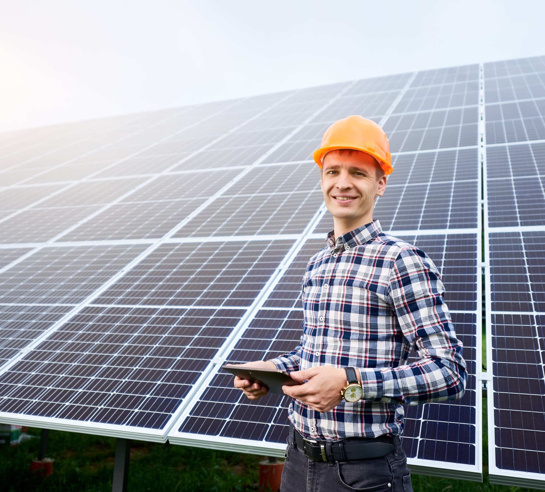 smiling-man-in-helmet-with-tablet-in-hands-stands-2025-01-17-00-03-03-utc(2)(1)(2)