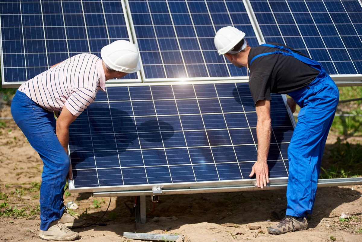 Stand-alone exterior solar panel system installation, renewable green energy generation concept.